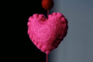 Part of a lovely wool felt string of hearts.
