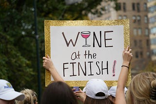Sing held up in a crowd calling for wine at the finish!