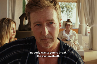 Ed Norton as Miles, saying ‘nobody wants you to break the system itself’