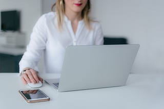 A young lady writing at her desk