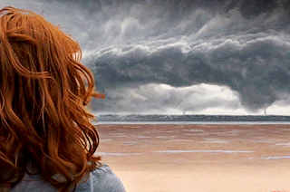 A red haired woman’s hair blows in the breeze in a cinemagram made from the 2011 film Take Shelter