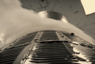 Movie clip from Hidden Figures. 3 people watching a space capsule stress test where a metal section flies off and hits the window in front of the people.