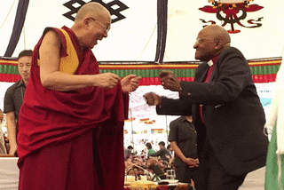The Dalai Lama and Archbishop Desmond Tutu dancing.