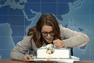 Tina Fey stuffs her face with cake using a fork