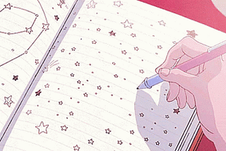 An anime’girl’s hand view as she draws stars in her notebook