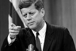 John F. Kennedy challenges you to put your network before yourself.