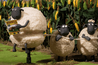 A gif from the Shaun the Sheep, where two sheep are unravelling the wool of a third sheep.