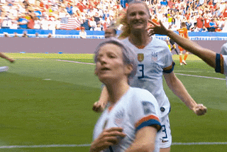 Megan Rapinoe celebrating a soccer game win.