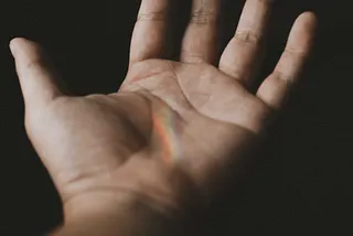 An open hand, the instrument of Cancellation.