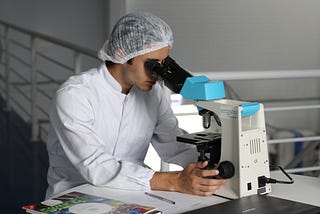 man with microscope