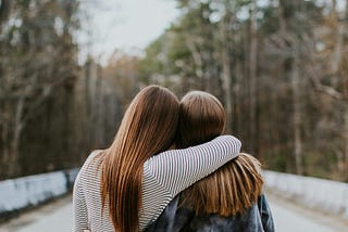 Two friends embracing