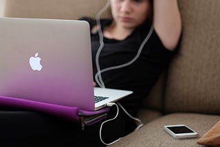 teen staring at computer screen