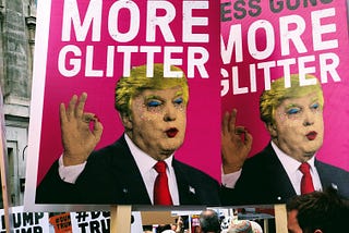 protest signs with an image of Donald Trump in drag: Less Guns More Glitter