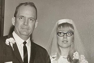 Black and white 1966 photo of father of the bride and bride