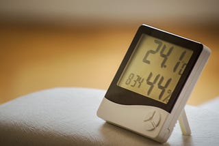 Electronic thermometer and hygrometer on Unsplash