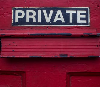 A red door saying ‘PRIVATE’