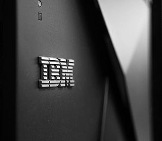 IBM logo on a dark grey wall