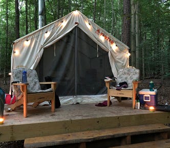 Glamorous tent on a platform with two chairs