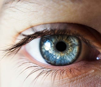 Close-up of a blue eye with long eye lashes