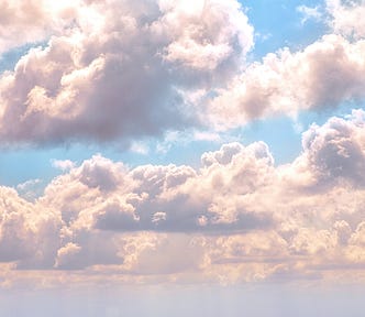 Fluffy clouds in a blue sky