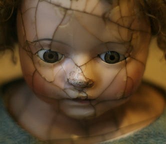 a doll with a broken face