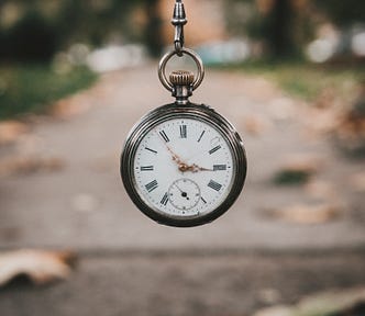 Antique timepiece set against a fall background