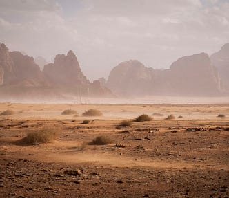 Desert and mountains. Dust blowing