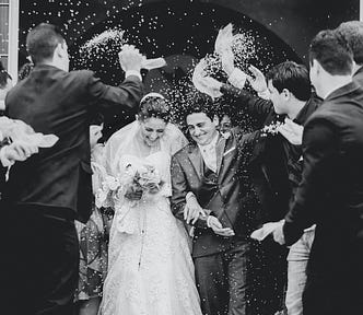 Rice thrown at a couple getting married