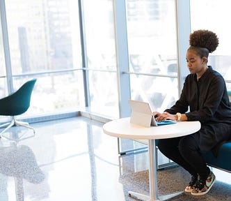 Woman at work, wearning sneakers.