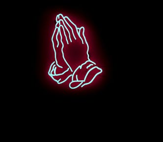A neon sign in the shape of praying hands