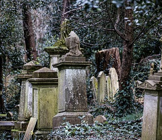 Ancient monuments in the oldest cemetery at Highgate that have been weathered by moss.