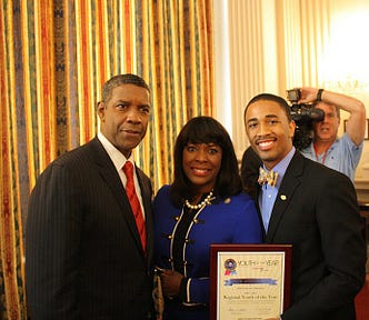 An image of Denzel Washington giving an award for the Boys and Girls Club of America