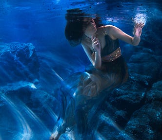 photo of a mermaid under water