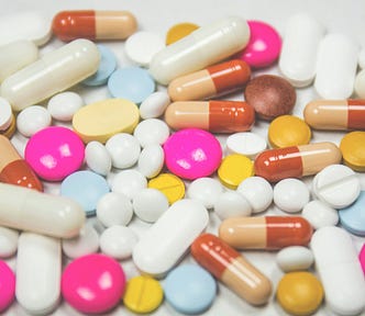 A colorful batch of medications in pill, capsule, and caplet forms.