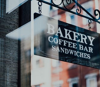 Bakery sign hanging in the window