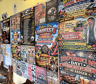 AI-created posters tacked to a wall that all look similar