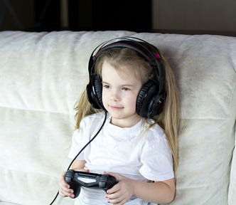 A little girl is playing some video games. (My daughter is a genius because I’m a genius. In other words, Smillew is a genius. Follow Smillew everywhere Substack Twitter.)
