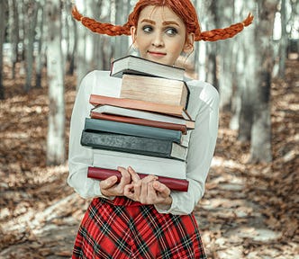 A woman carrying a stack of books in the forest. She has to braids and they are flying in the “wind”.