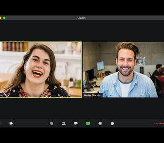 White woman and man in a Zoom video call