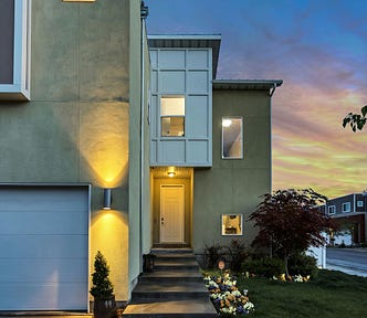 Beautiful modern home exterior with “curb appeal” for real estate price optimization.