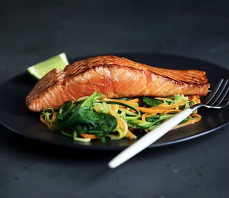 Type 2 diabetes can be managed with a healthy diet such as this salmon and salad plus regular exercise