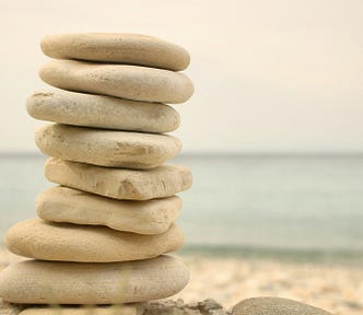 a stack of stones on a beach