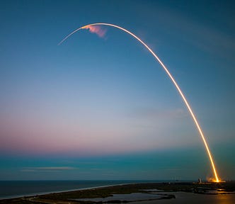 A rocket launching into space.