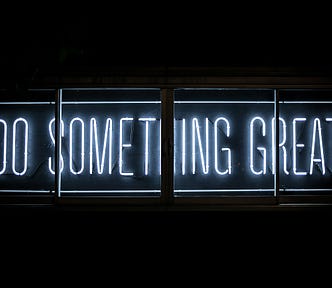 Black background with white text reading “Do Something Great”