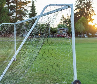A goal post on a playing field.