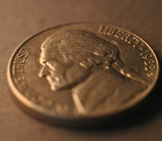 An angled photo of a US .05 nickel