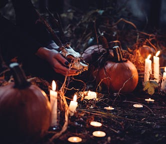 A witch works a Halloween ritual.