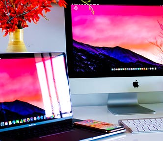 Laptop and desktop computers on desk