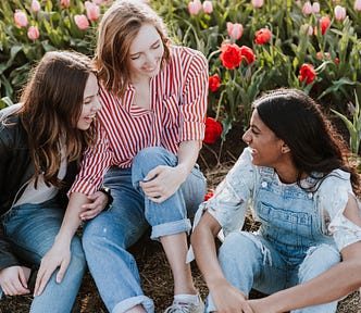 Three teenagers having a laugh.