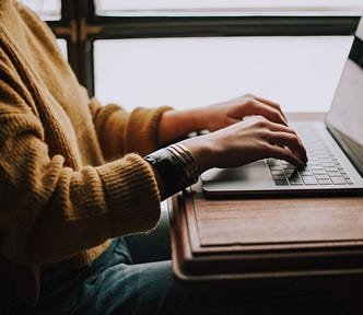 Person typing on a laptop